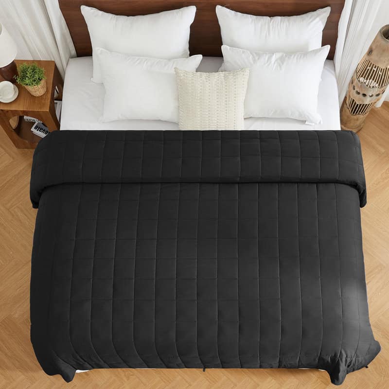 Soft weighted throw blanket draped over a sofa
