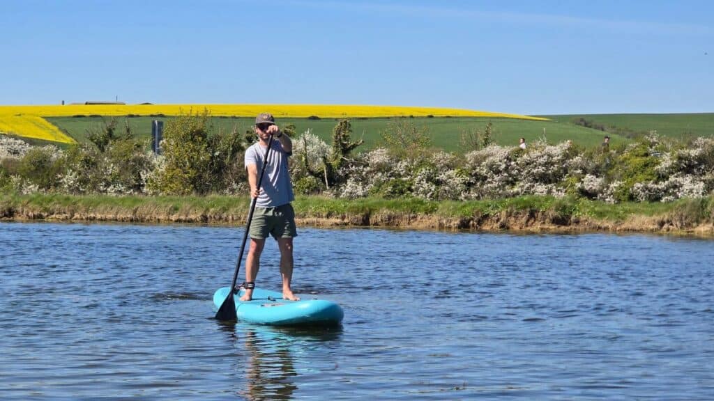 Best Paddle Board for Beginners UK: 8 Top SUPs Compared (2026) 2 Wave Cruiser Paddle Board on the water