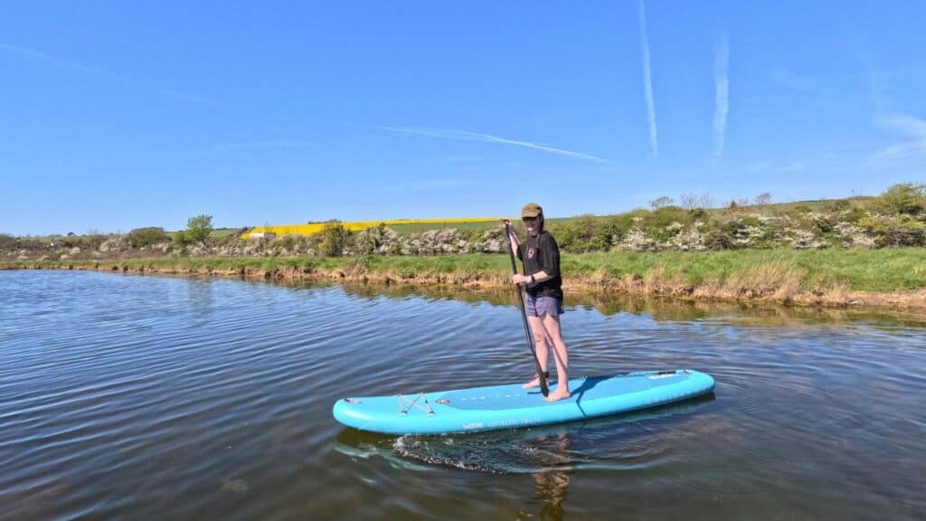 Wave Cruiser vs Wave Tourer: Which Wave Board Should You Buy? (2026) 4 Performance on the water - Becci on the Wave Cruiser