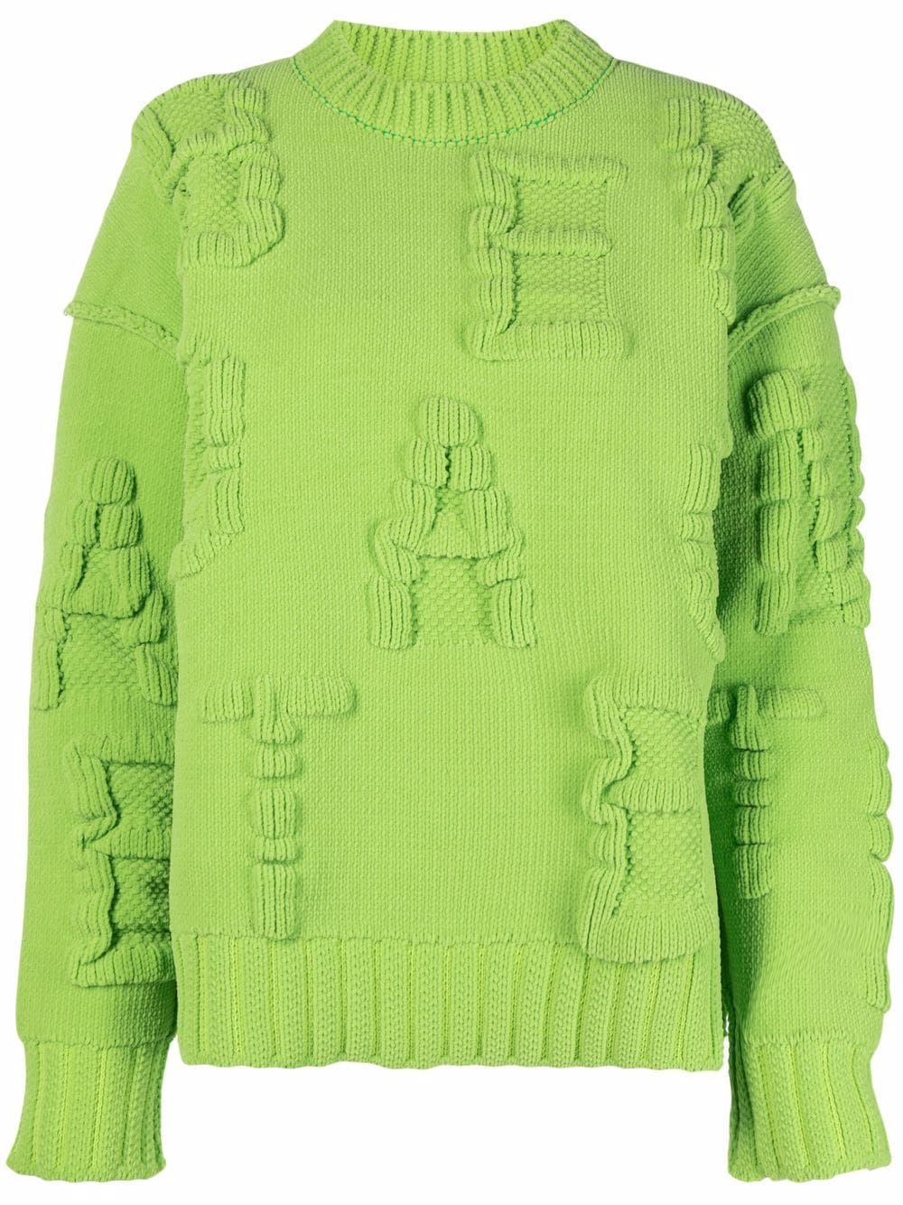 1. Malha verde vibrante com detalhes texturizados e corte oversized.