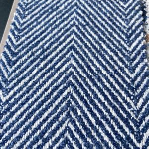Kleurrijk blauw en wit zigzag patroon, perfecte interieurstof voor meubels en decoratie.