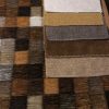 Diverse stofstalen met diepe aardetinten en texturen, perfect voor meubel- en interieurdecoratie.