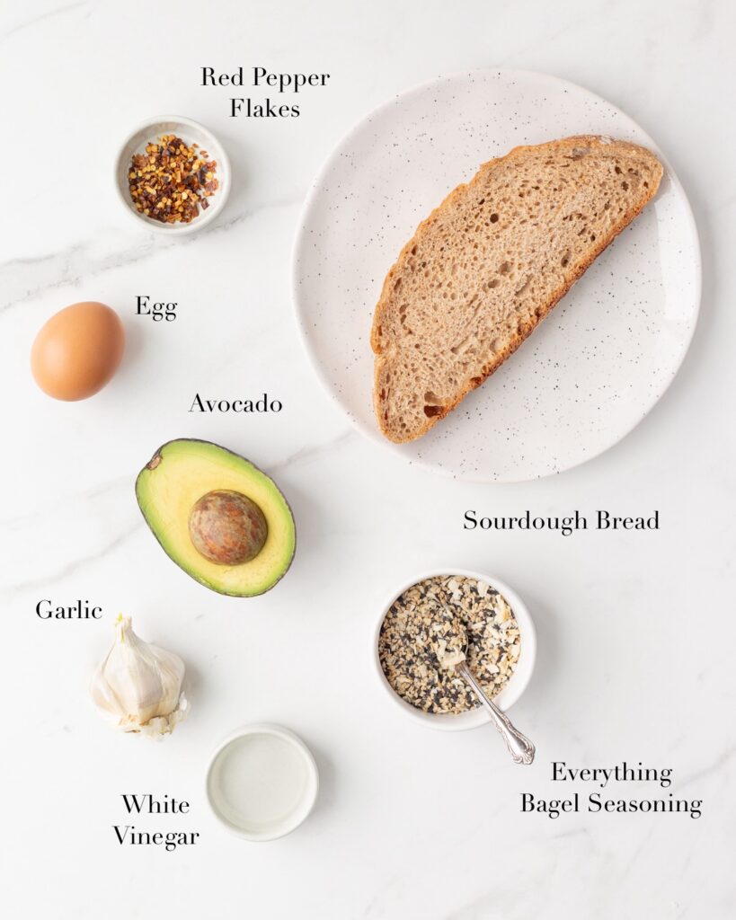 Ingredients for Avocado Toast portioned out on a marble slab.