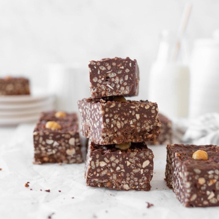 3 Chocolate Hazelnut Crunch Bars stacked on top of one another.