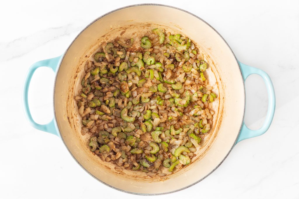 Process shot #2: chopped onion, celery and garlic cooked in a large soup pot with spices. 