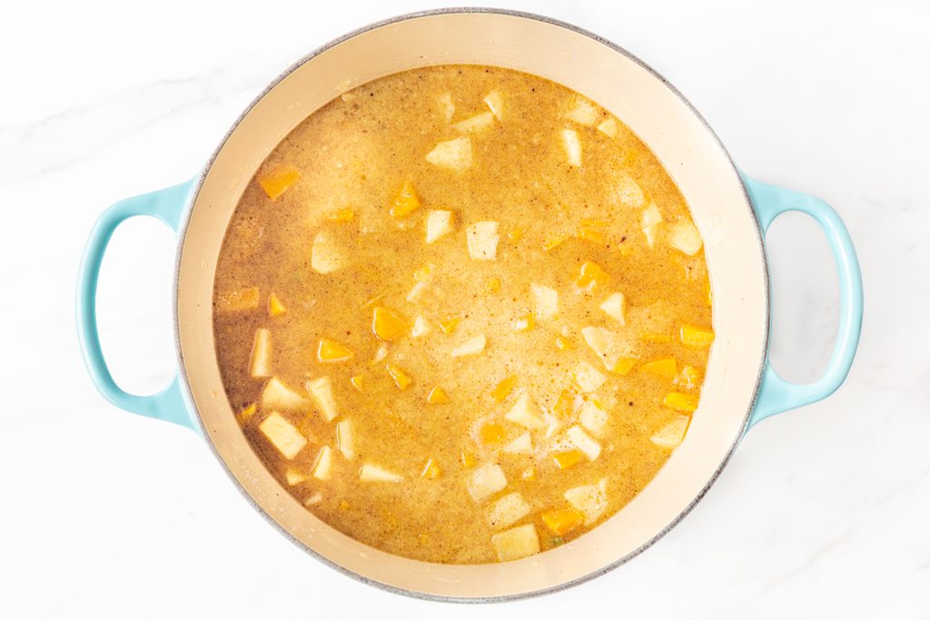 Process shot #3: broth, coconut milk and roasted squash and apples added to the soup pot.