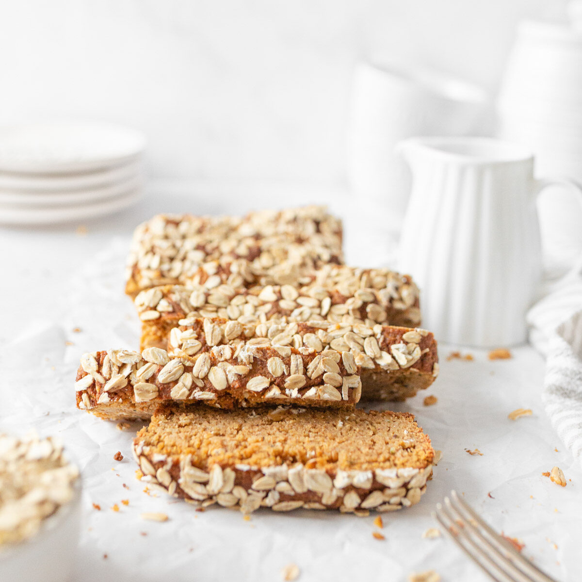Gluten Free Pumpkin Bread sliced on parchment paper.