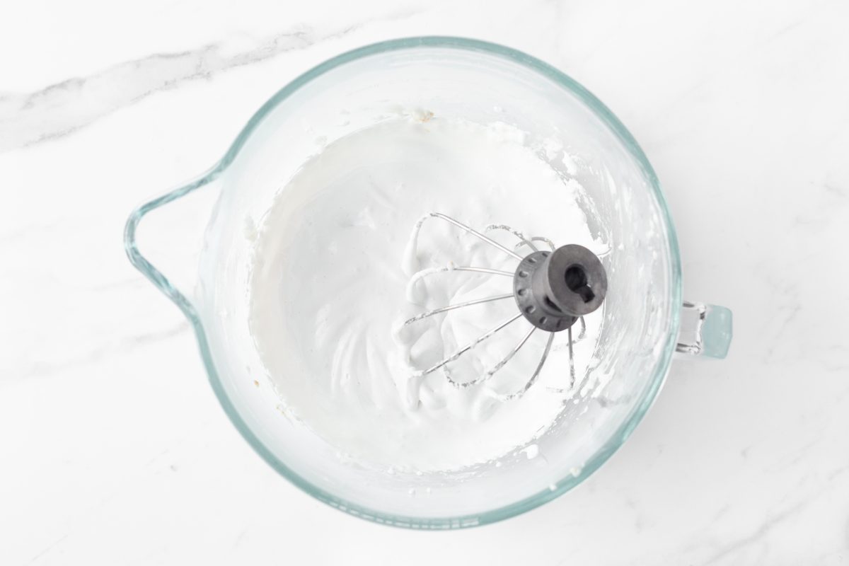 Process shot #2: Whipped egg whites in a glass bowl.