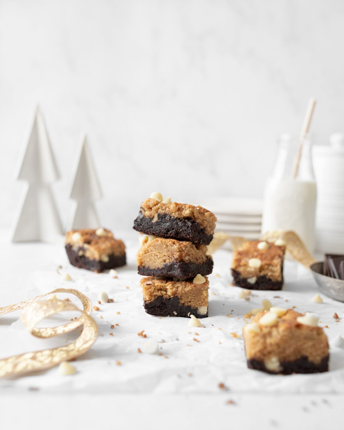 3 Gluten Free peppermint Chip Brookies stacked on top of each other on parchment paper.