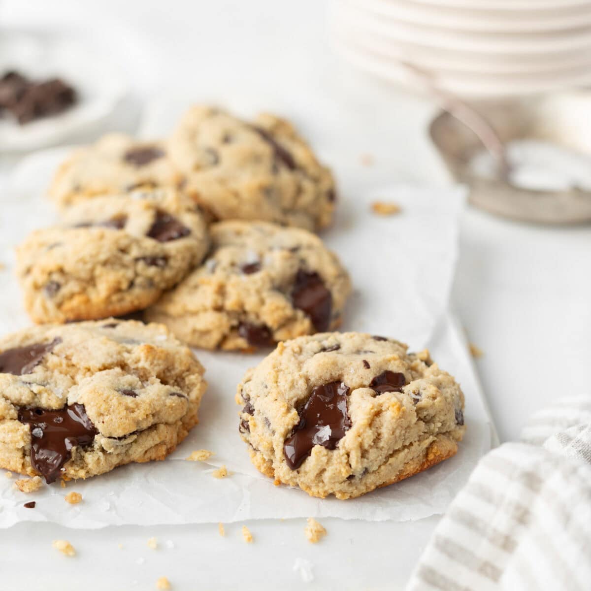 Gluten Free Chocolate Chip Buckwheat Cookies baked and styled on parchment paper.