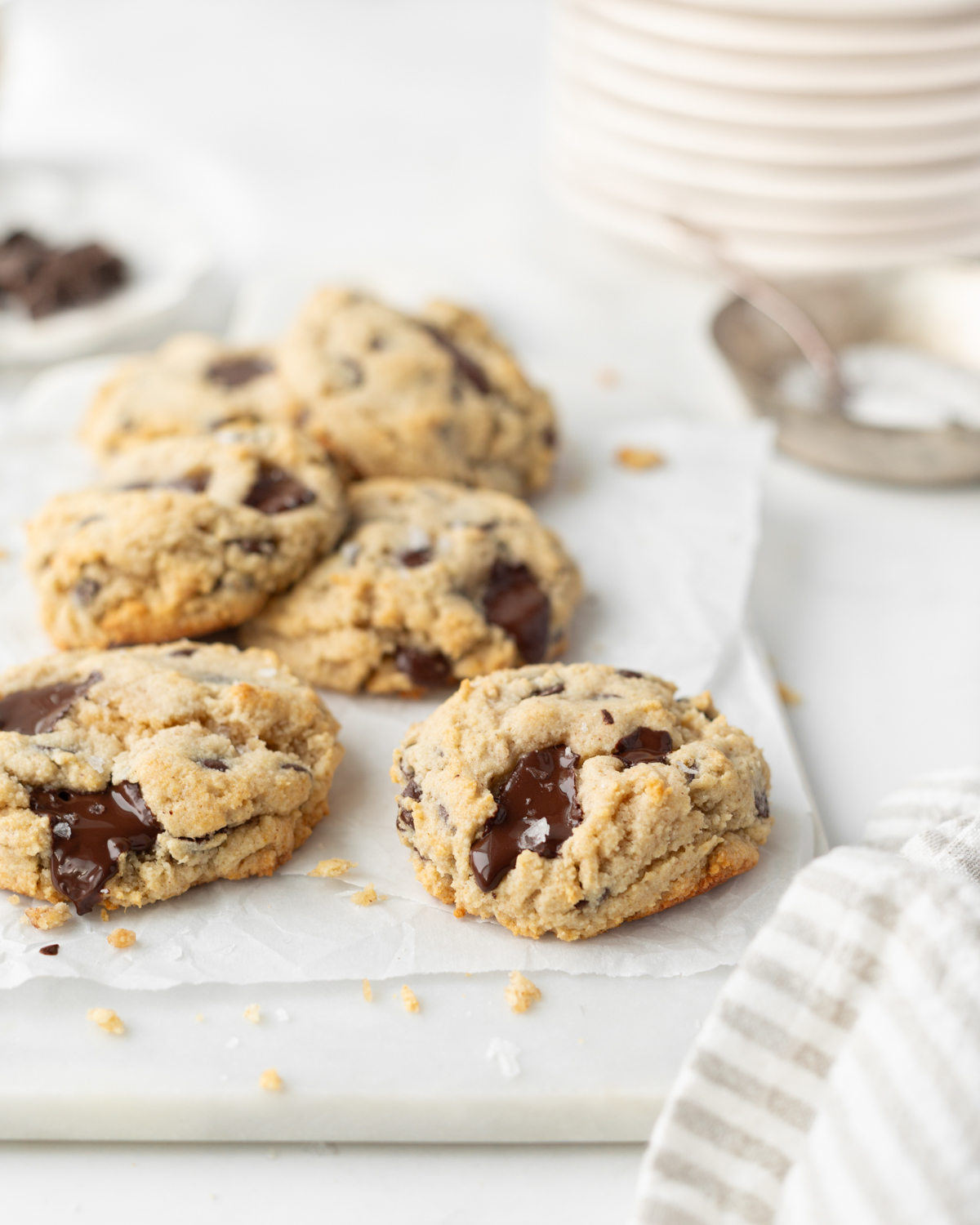 Gluten Free Chocolate Chip Buckwheat Cookies baked and styled on parchment paper.