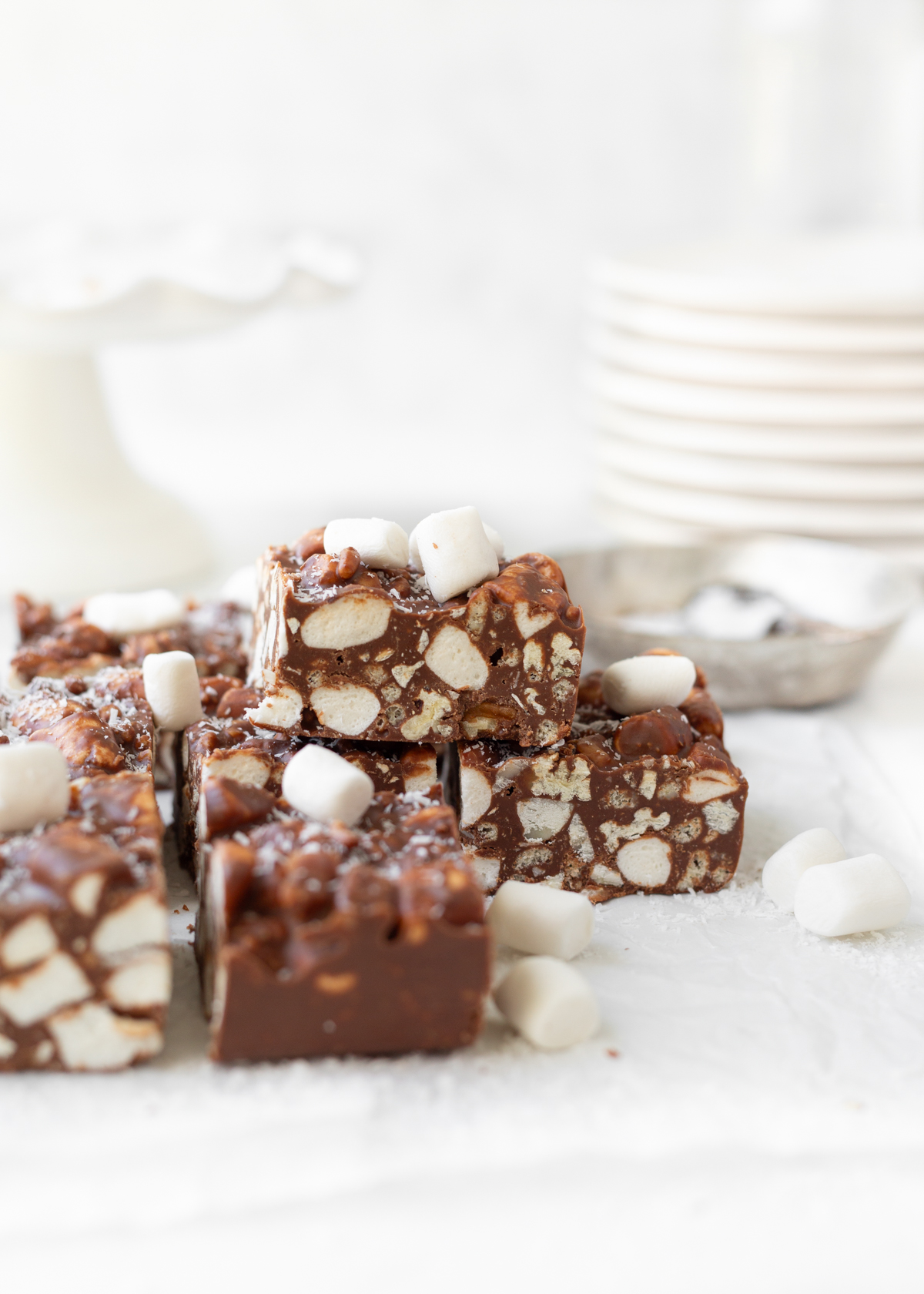 Rocky Road Bars cut on top of parchment paper.