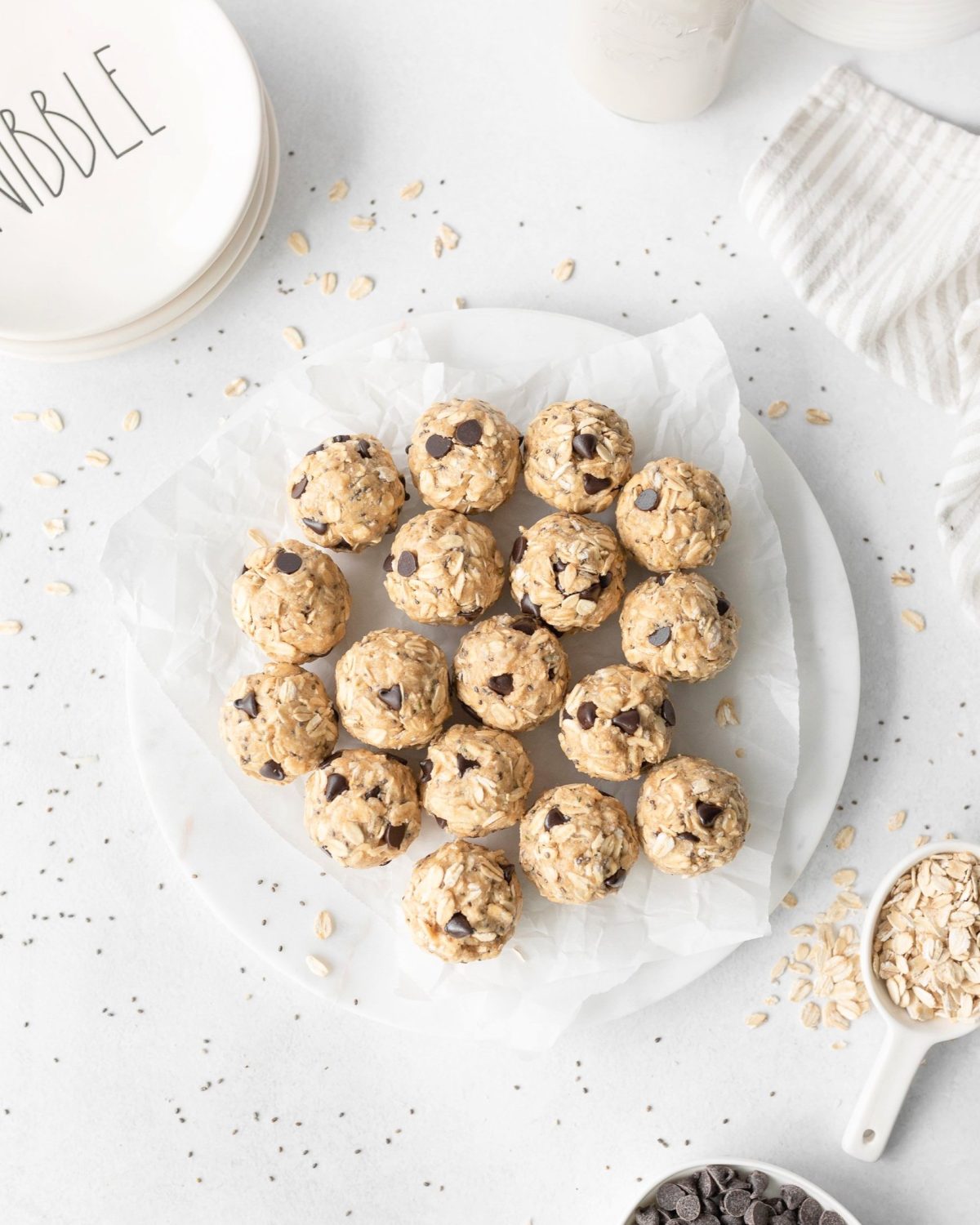 Oatmeal Cookie Protein Bites on a parchment-lined plate.