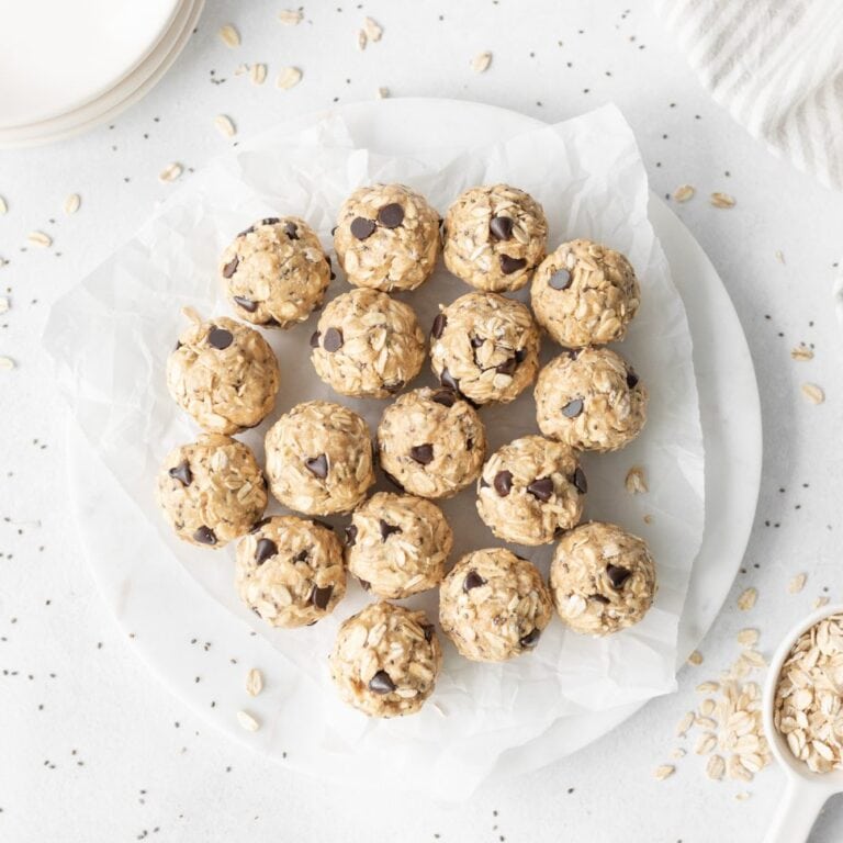 Oatmeal Cookie Protein Bites on a parchment paper-lined plate.