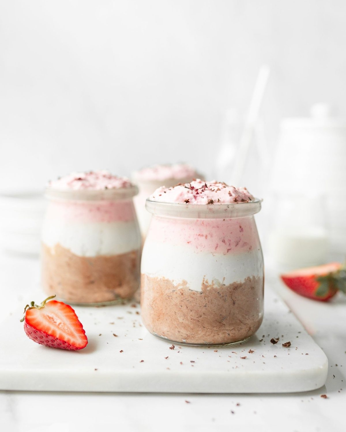 10-Minute Neapolitan Mousse portioned into small jars.