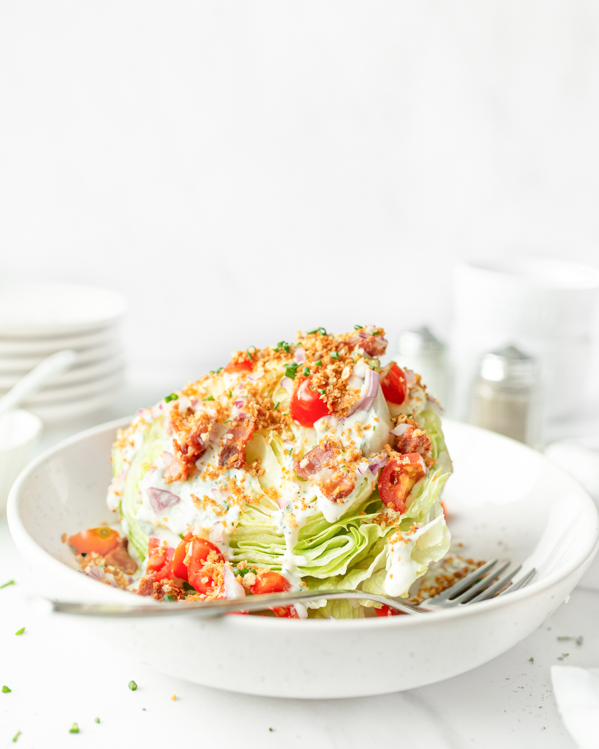 Summer Wedge Salad with Ranch Dressing plated and topped with crispy breadcrumbs.