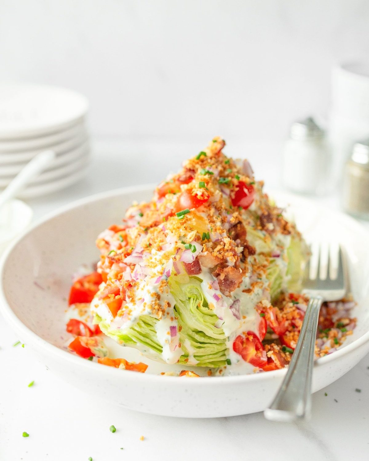 Wedge Salad plated and topped with toasted breadcrumbs.