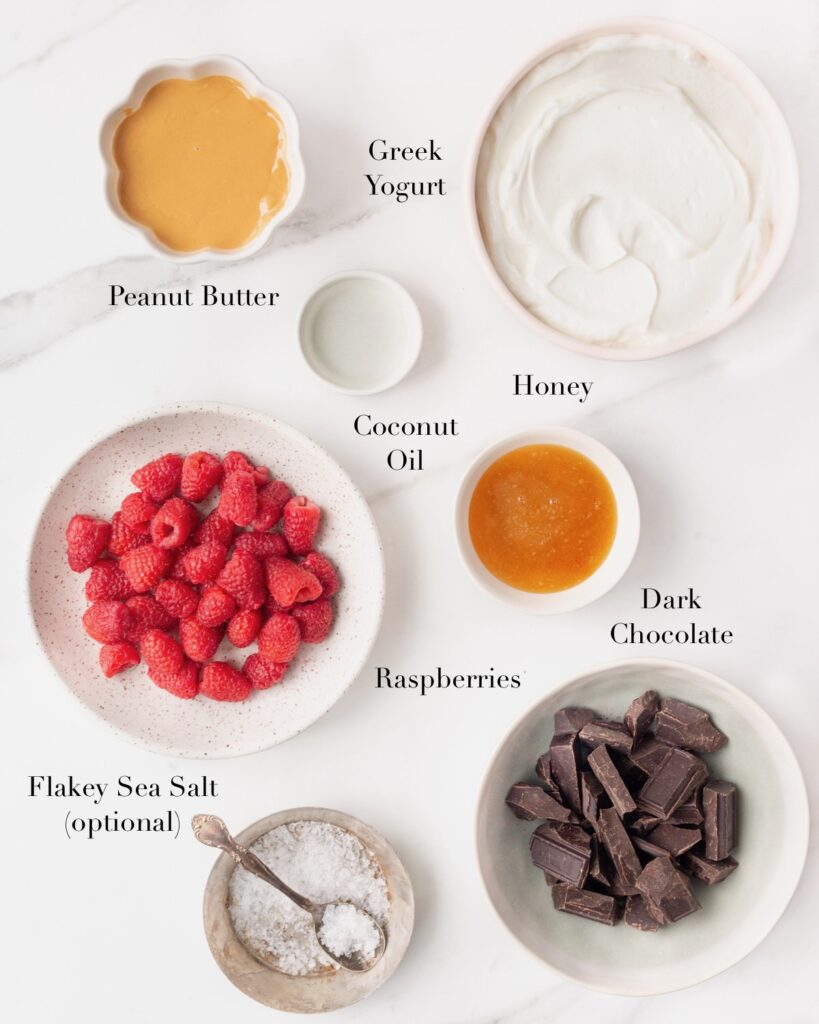 Ingredients for Peanut Butter & Jam Frozen Yogurt Bars portioned out on a marble slab.