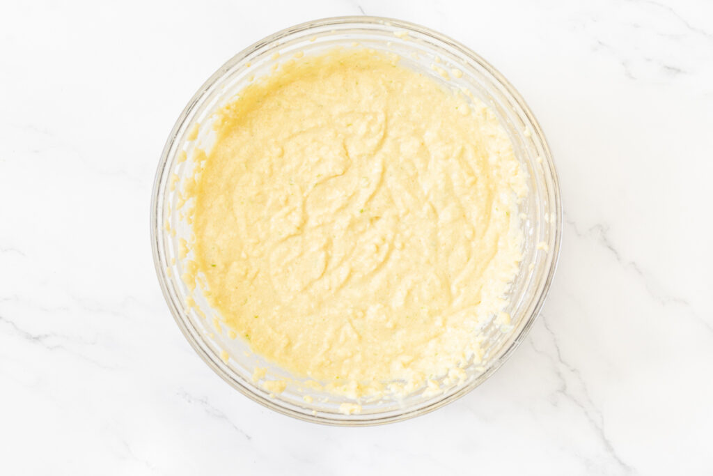 Process shot #3: gluten free cupcake batter mixed in a medium-sized, glass mixing bowl. 