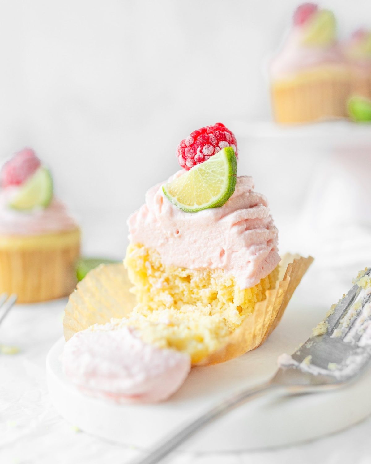 Gluten Free Key Lime Cupcakes assembled and cut in half.