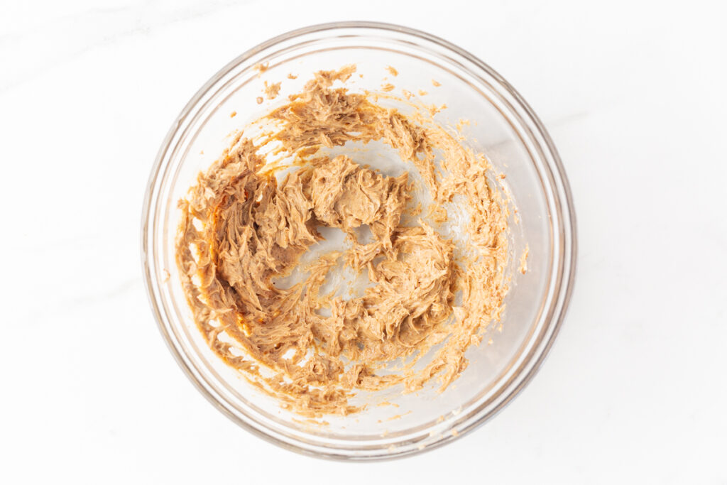 Process shot #2: Softened butter, vanilla extract, brown sugar, cinnamon, nutmeg and salt whipped in a glass mixing bowl.