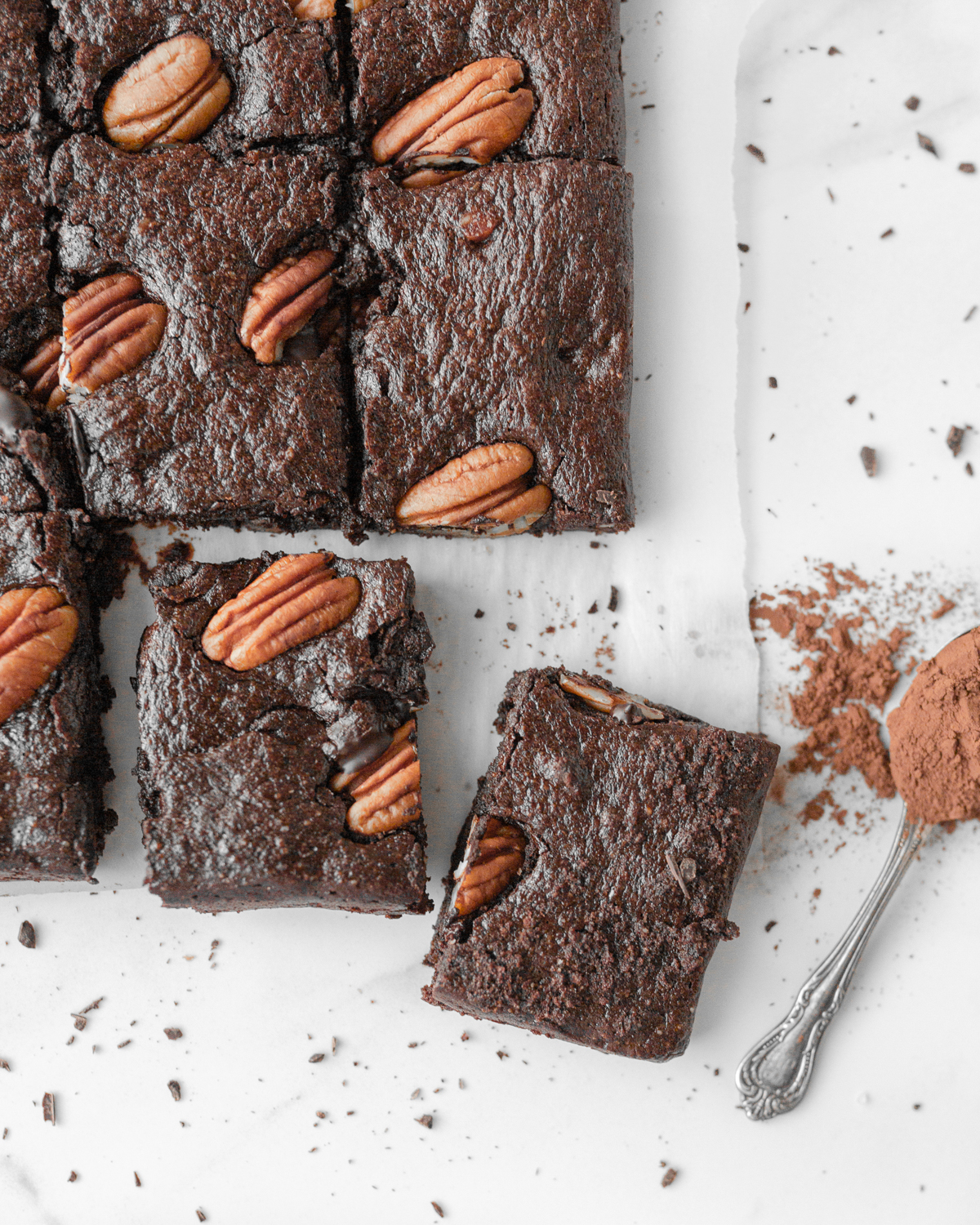 Triple Chocolate Collagen Brownies cut on parchment paper.