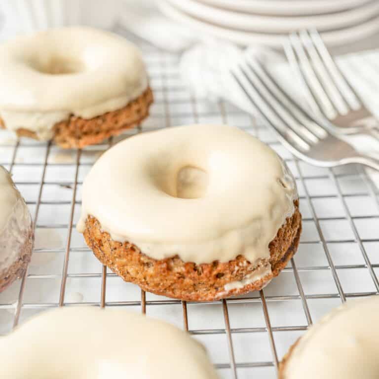 Gluten Free Banana Bread Donuts dipped in maple glaze.