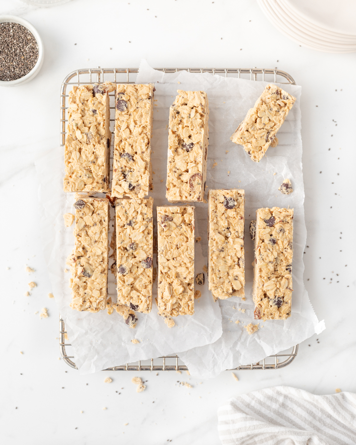 Protein Granola Bars cut into bars on parchment paper.