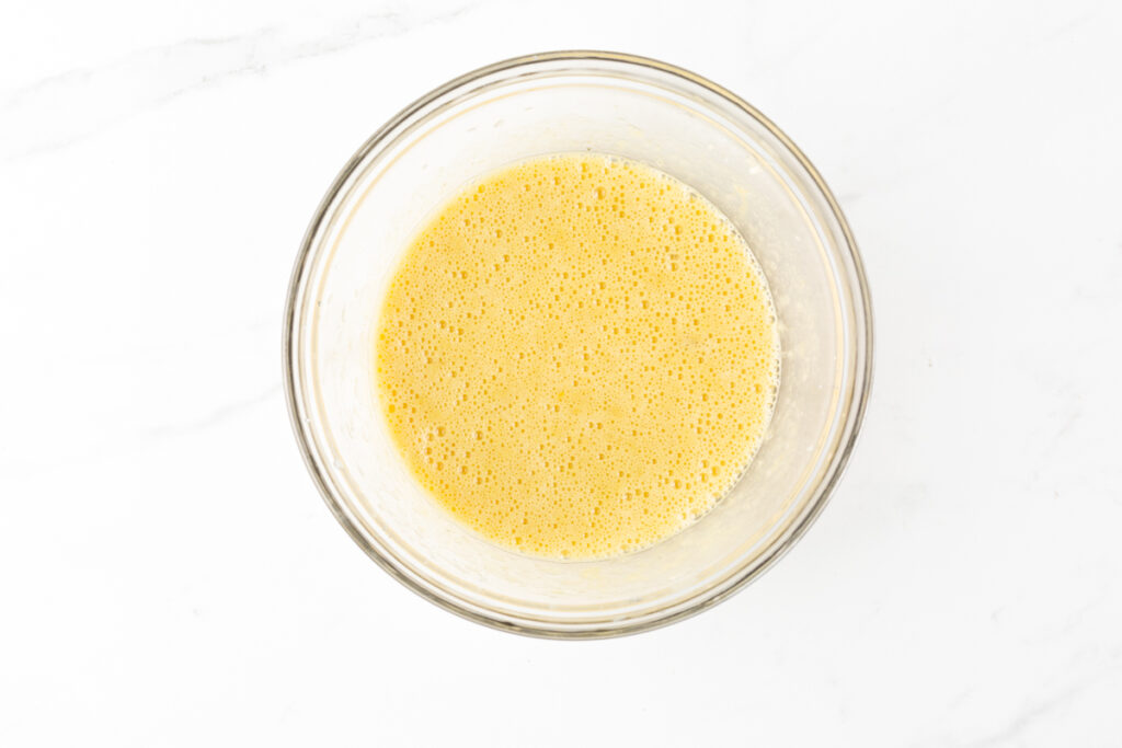 Process shot #2: whisked bananas, xylitol, eggs and vanilla extract in a medium-sized glass bowl.