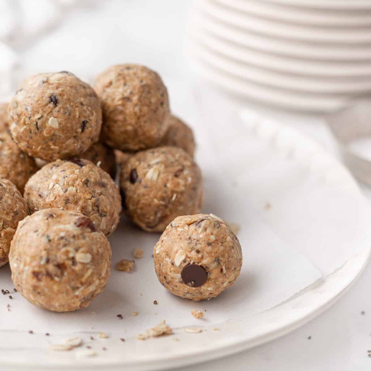 Chocolate Almond Butter Protein Bites stacked on a plate.