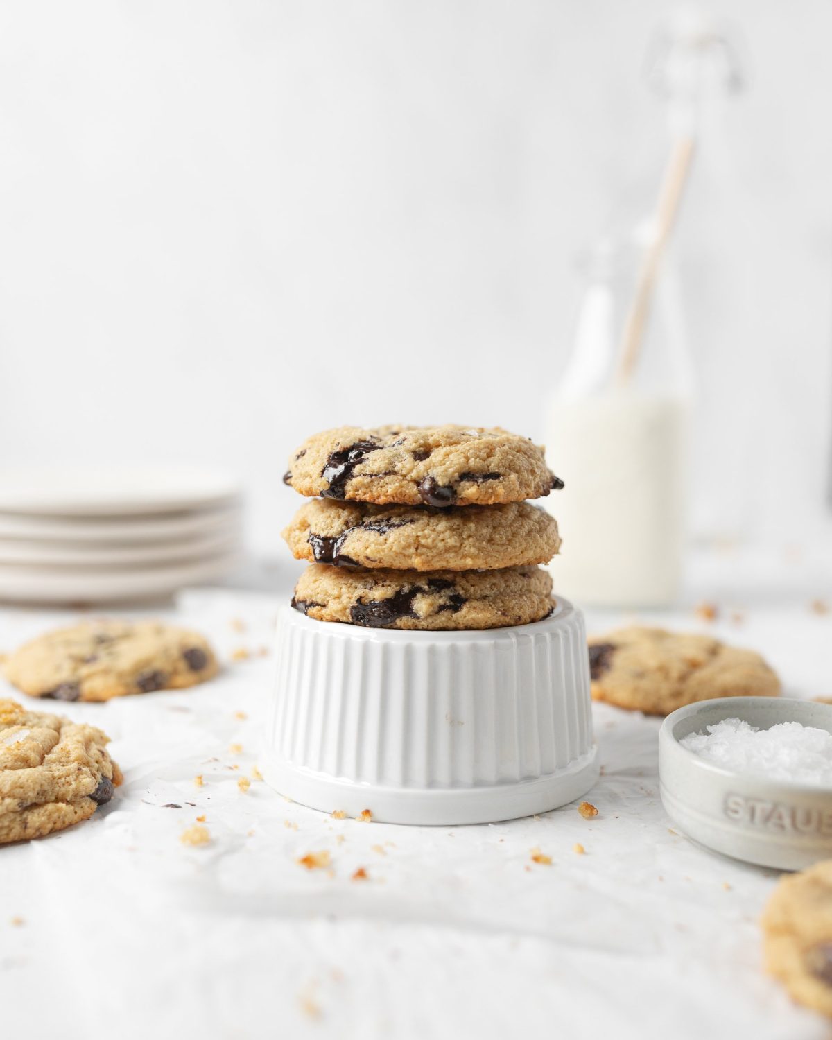 A stack of Chewy Gluten-free Peanut Butter Protein Cookies on top of a ramekin.