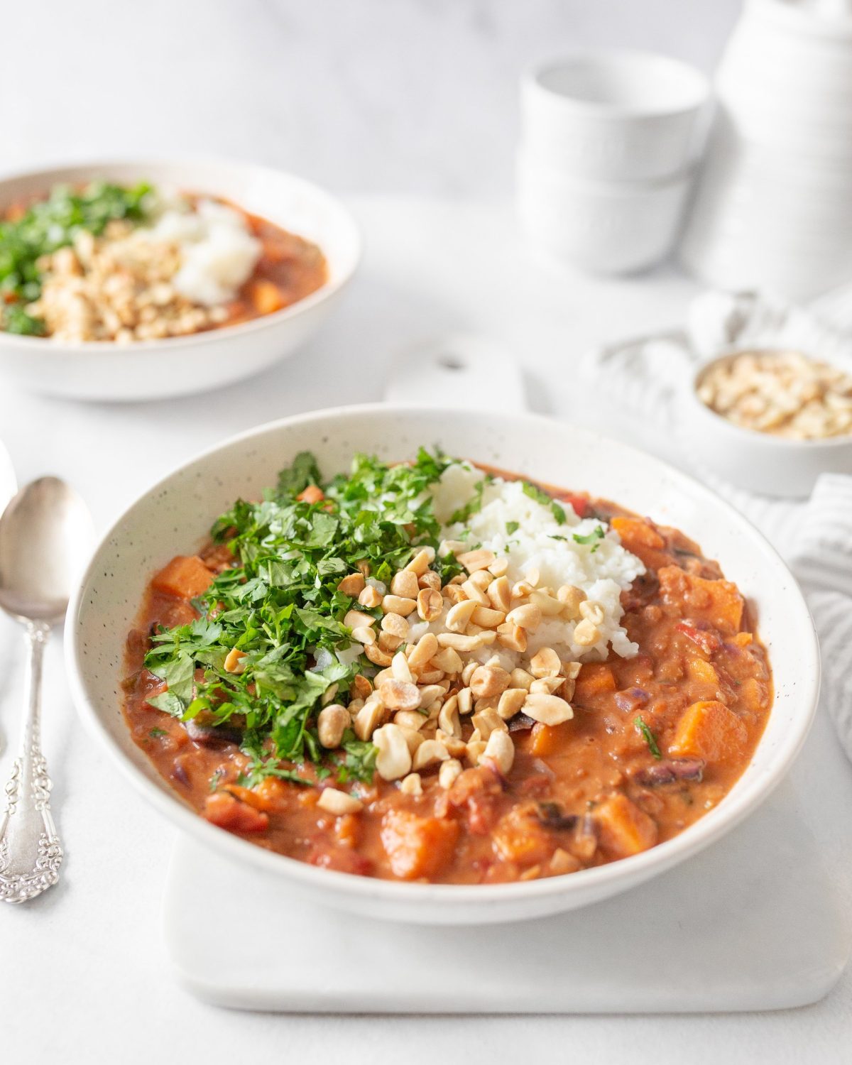 Vegan African Peanut Stew served in a shallow bowl.