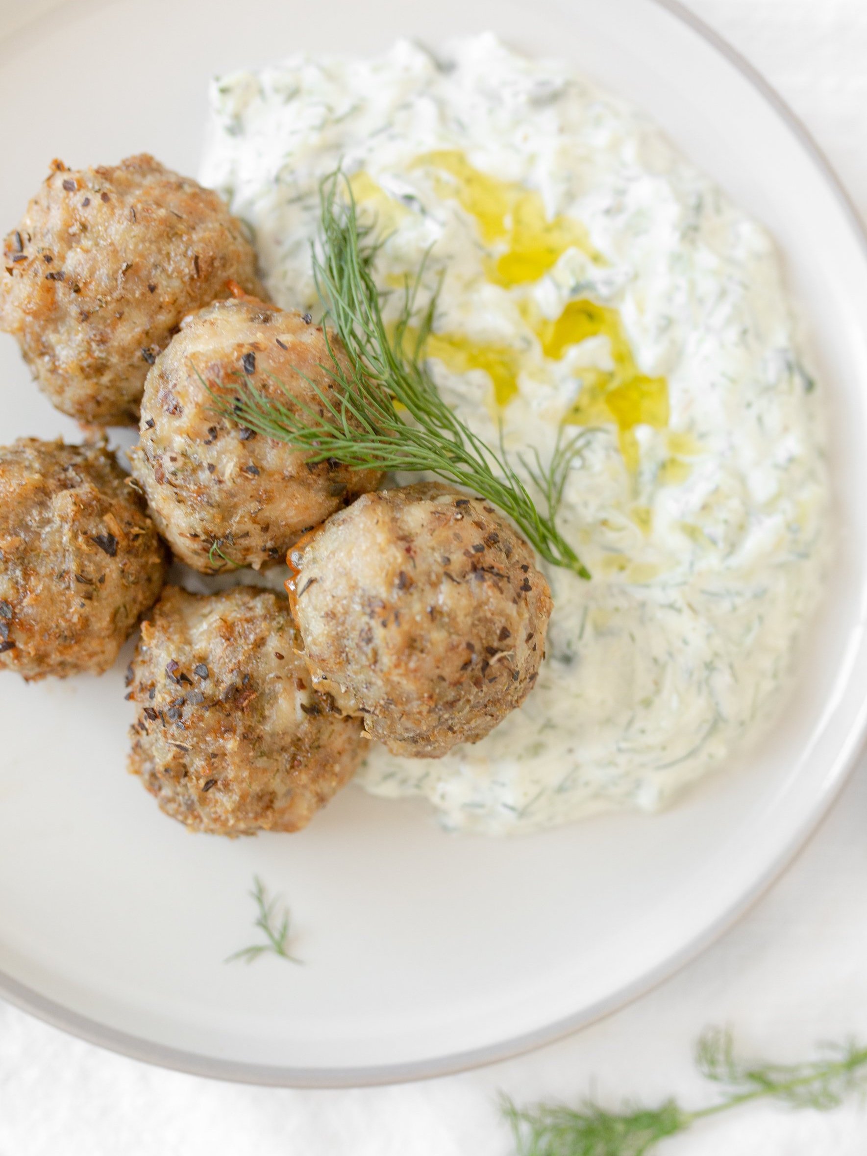 Greek-style Chicken Meatballs with Tzatziki (top down, close up)