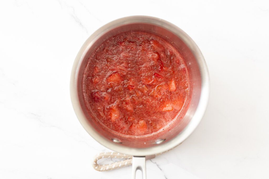 Process shot #1: Strawberry Rhubarb compote cooked and reduced in a small saucepan. 