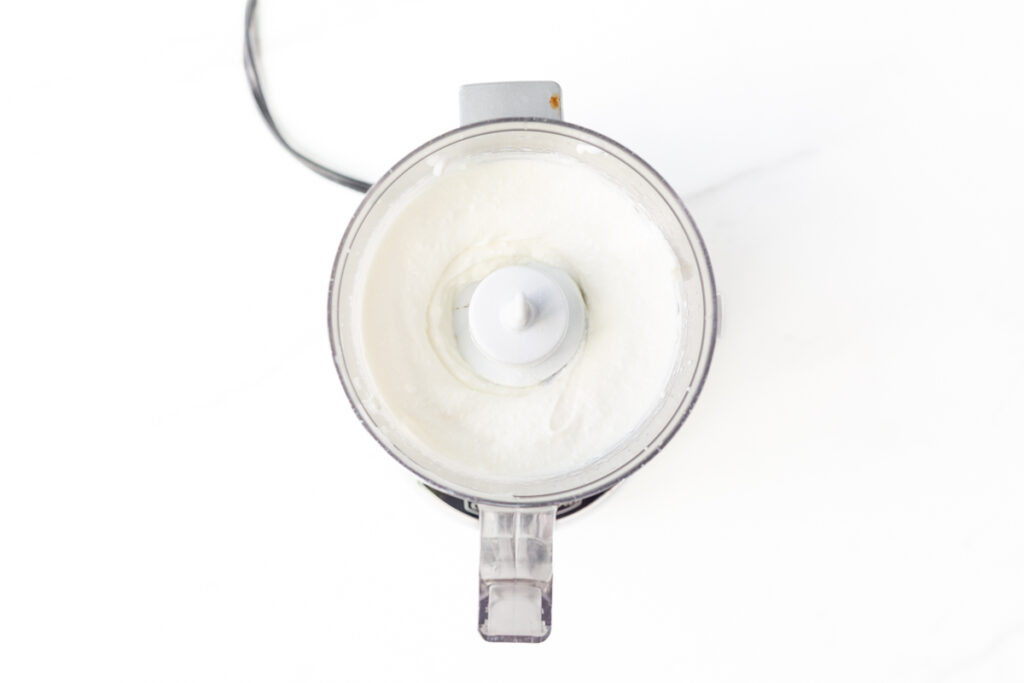 Process shot #1: Greek yogurt and cottage cheese blended until smooth in a food processor.