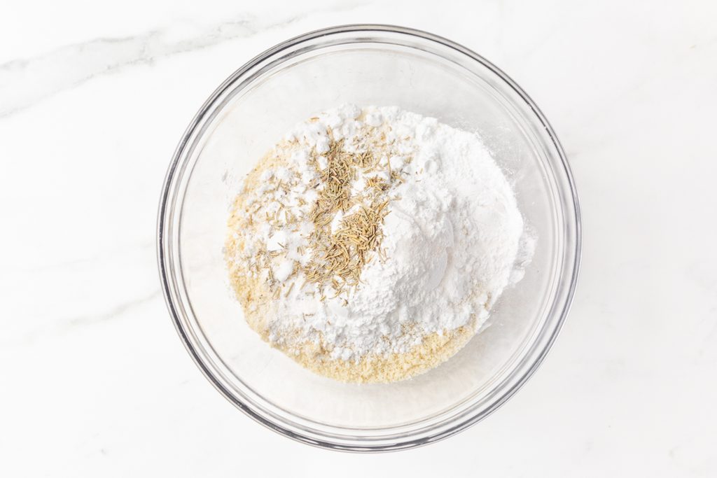 Process shot #2: dry ingredients for almond flour biscuits in a glass mixing bowl.