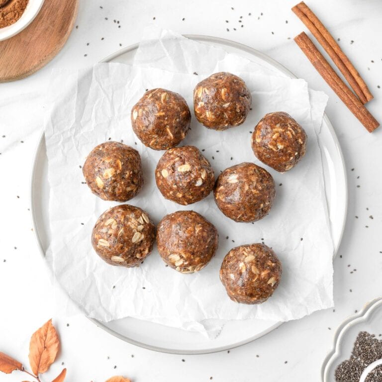 Cinnamon Protein Bites on a parchment-lined plate.