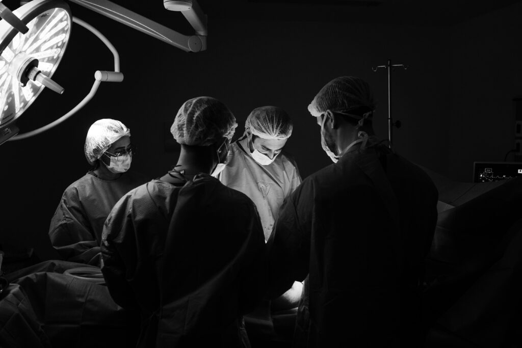 Surgeons Performing Surgery | Surgical Instruments Manufacturer A team of surgeons performing surgery in an operating room, using CE & ISO-certified surgical instruments supplied by Salwans.