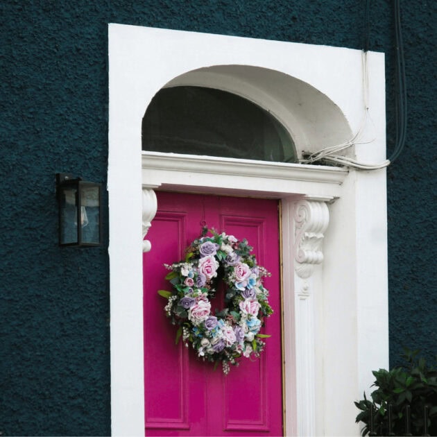 a pink door and Valentine's rose wreath
