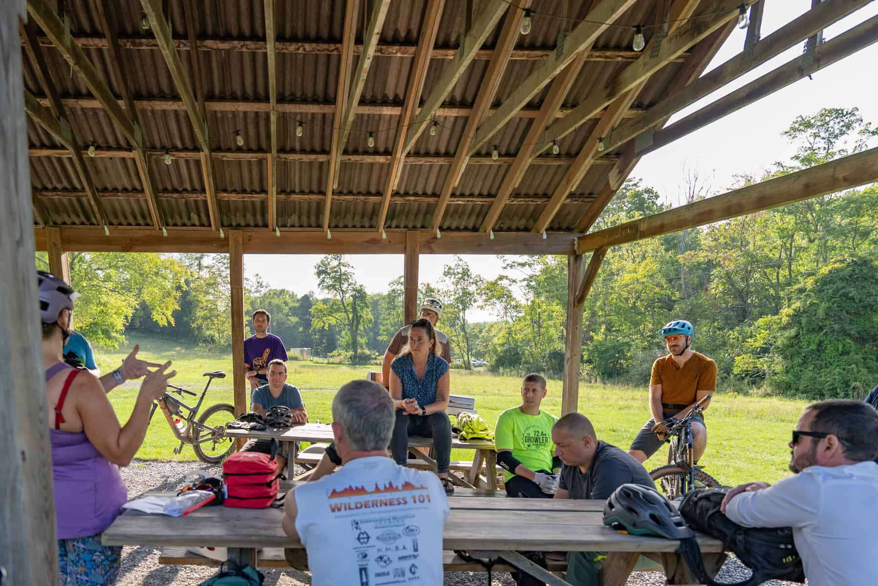 Riders gathered under the pavilion at the Western Slope trailhead, ahead of Western Slope hunting season