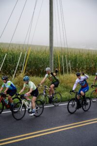 Riders in the fog on a country road during the century ride