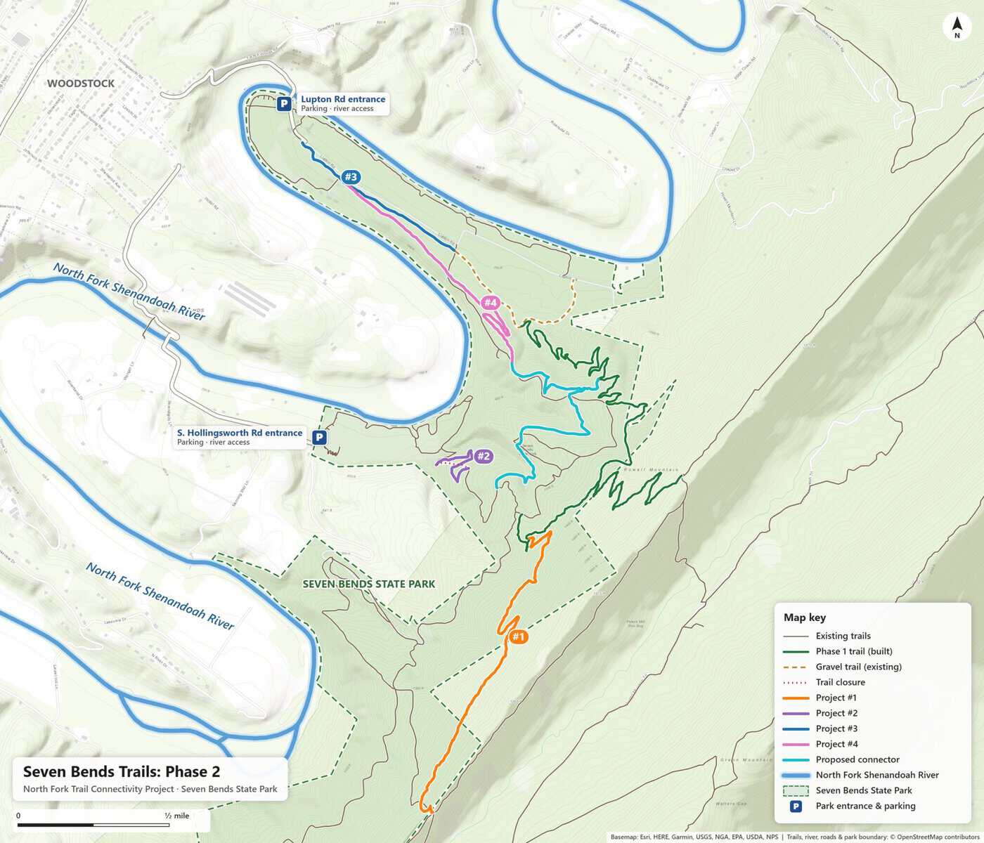 Map of Seven Bends State Park near Woodstock, Virginia, showing the built Phase 1 trail in green, four numbered Phase 2 trail projects, a proposed connector trail in light blue, a planned trail closure, and park entrances with parking at Lupton Road and South Hollingsworth Road.