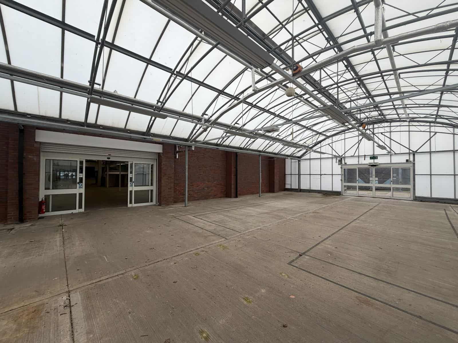 Retail Fit-Out Cost Management: Homebase to The Range, Upton 2 Empty glazed garden centre canopy at the former Homebase, Upton