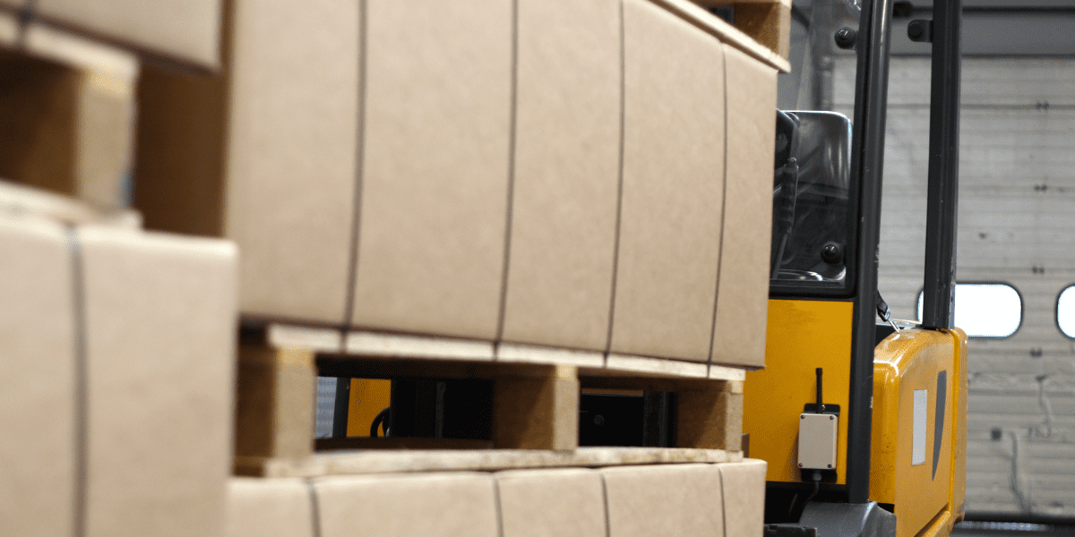 forklift behind a big stack of boxes