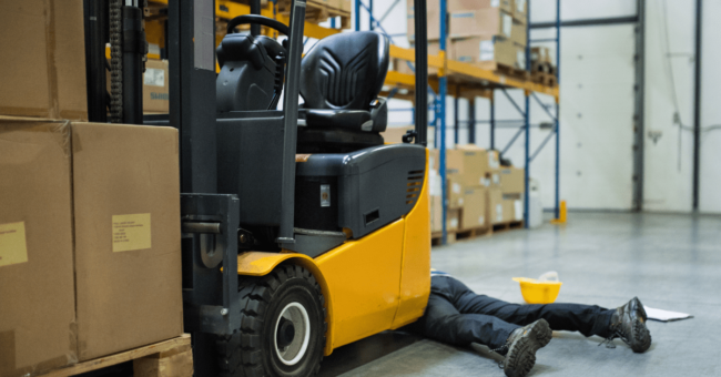 person injured on the floor in front of a forklift