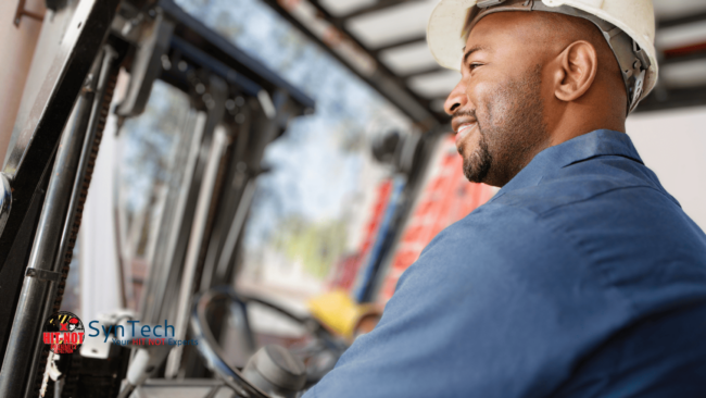 Forklift operator driving lift