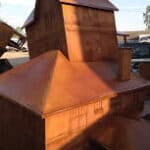 Artistic copper sculpture of a house for "The American Dream" installation.