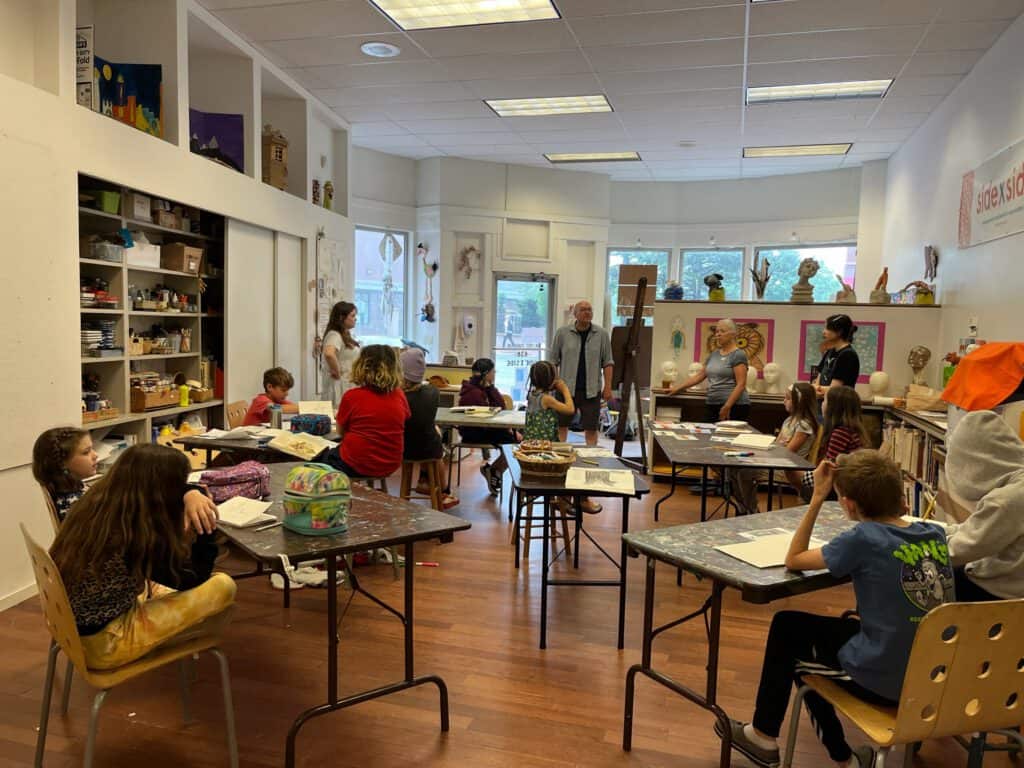 Children participating in a public art workshop during Summer 2023.