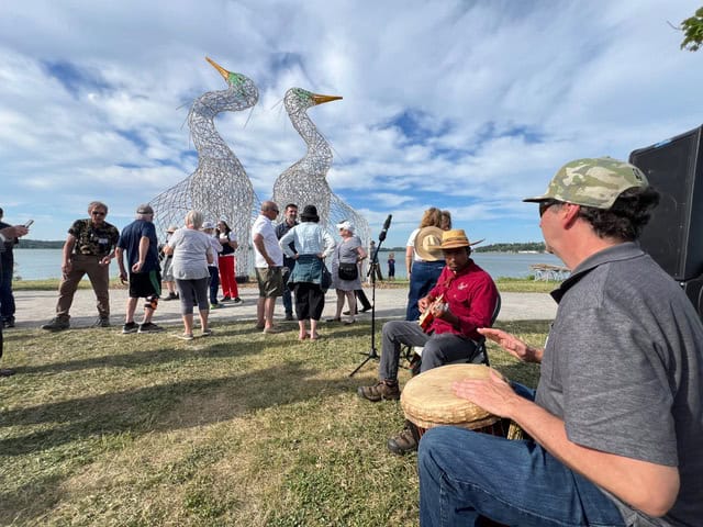 Community gathering at Dancing for Joy sculpture unveiling.