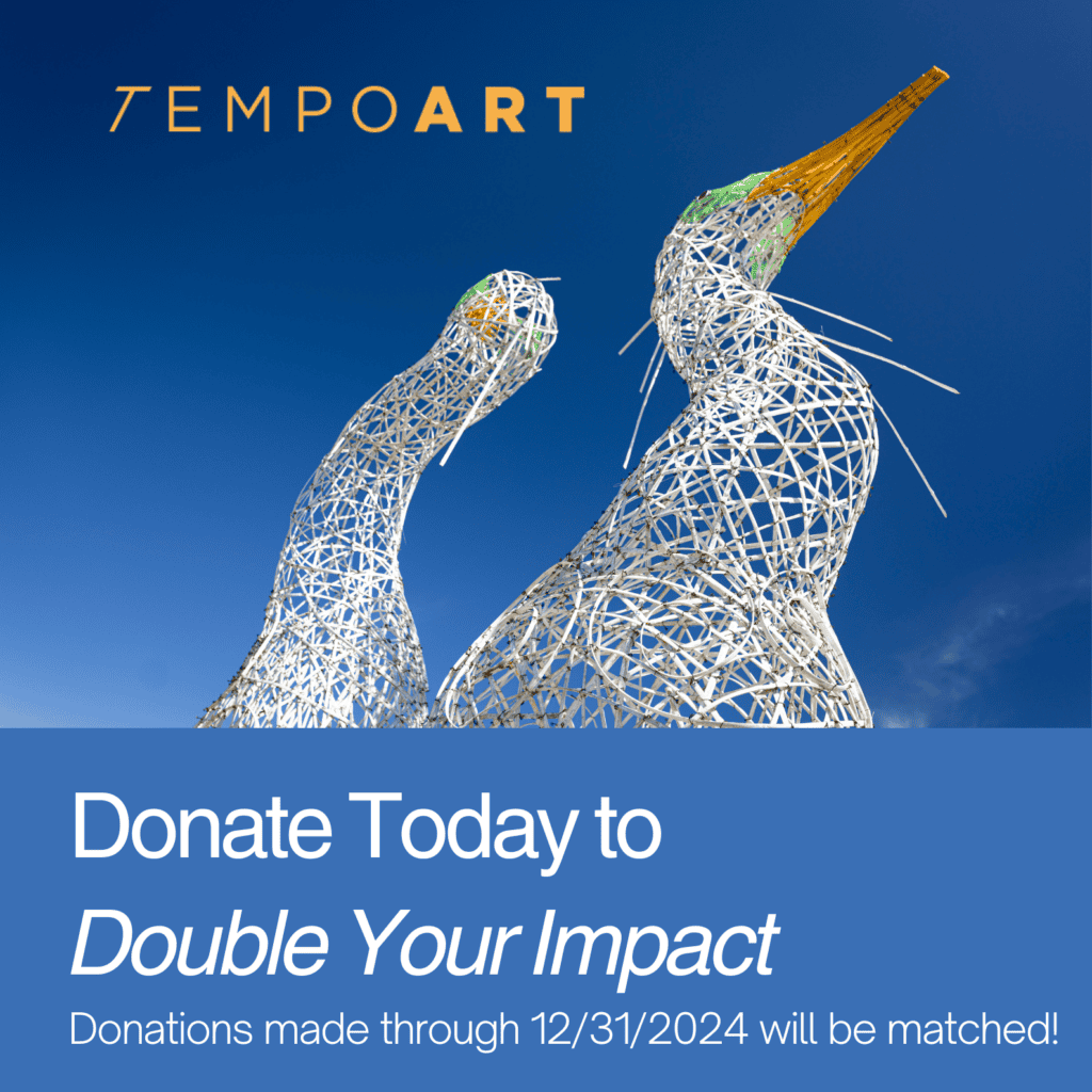 Artistic sculpture of two intertwined figures promoting donation awareness.